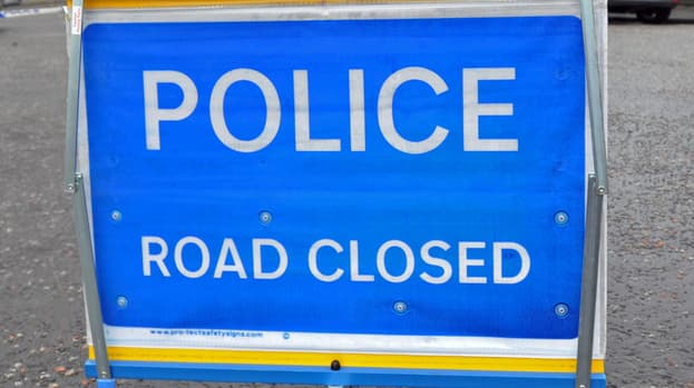 125869 quality shot of police road closed sign in edinburgh